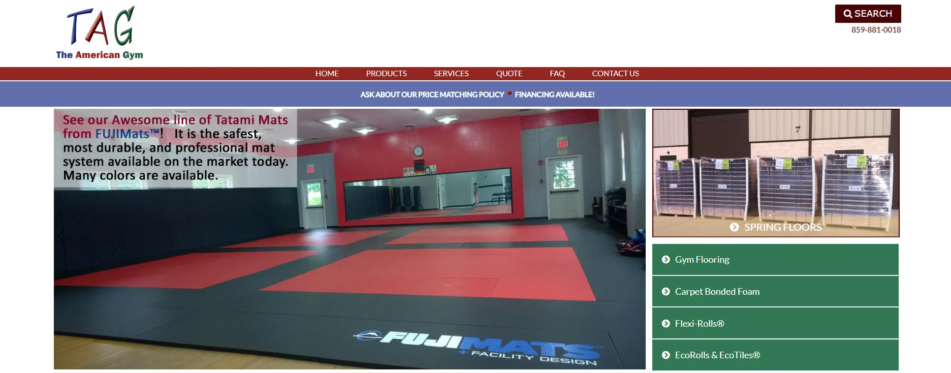 Spacious gym training room with FUJIMats flooring, featuring red and black tatami mats, wall mirrors, and bright lighting.