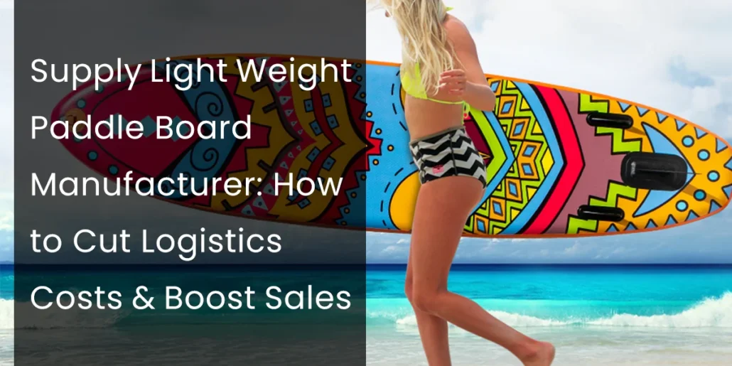 Woman in summer attire carrying a vibrant, colorful paddleboard on a beach with turquoise water and blue sky.