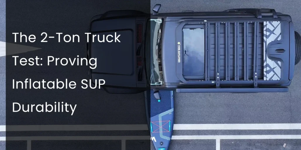 Top view of a large truck parked on a road with an inflatable stand-up paddleboard beside it, showcasing a durability test.