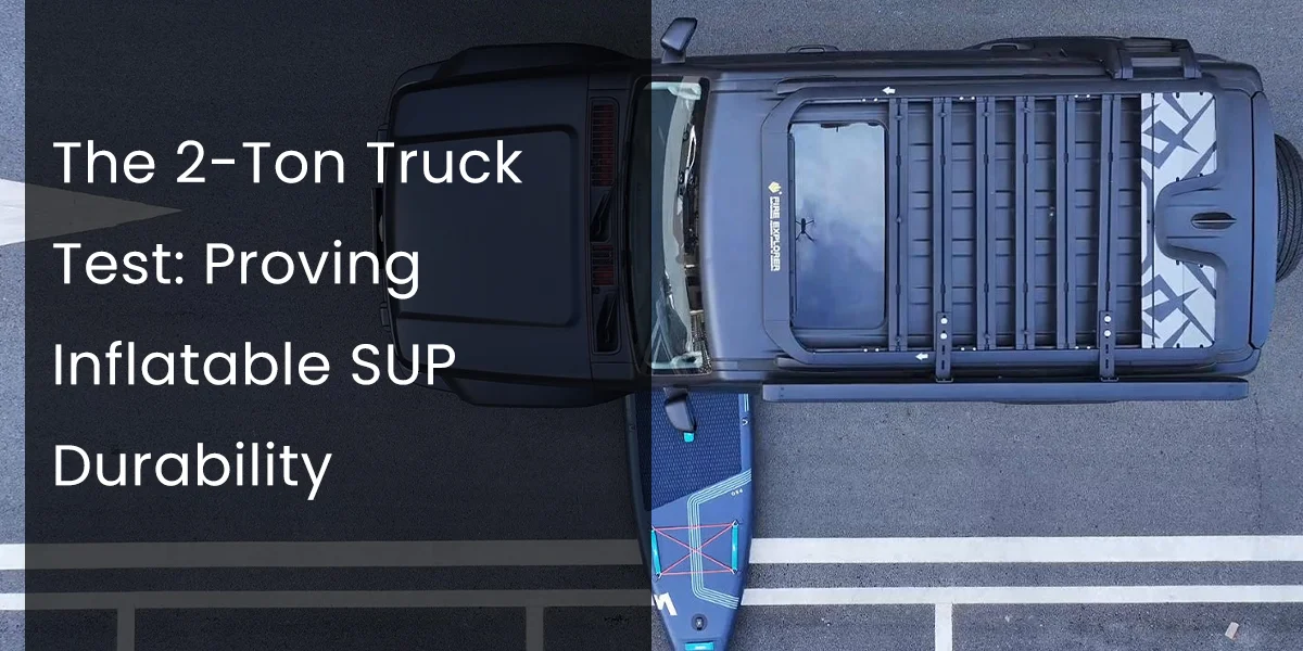 Top view of a large truck parked on a road with an inflatable stand-up paddleboard beside it, showcasing a durability test.