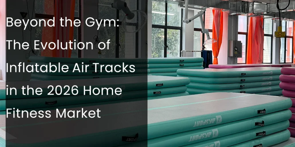 Stacked inflatable air tracks in a fitness studio with large windows and orange curtains in the background.