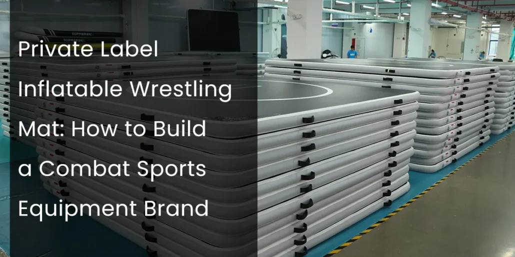 Factory interior with stacked inflatable wrestling mats on the floor, showcasing production environment for combat sports equipment.