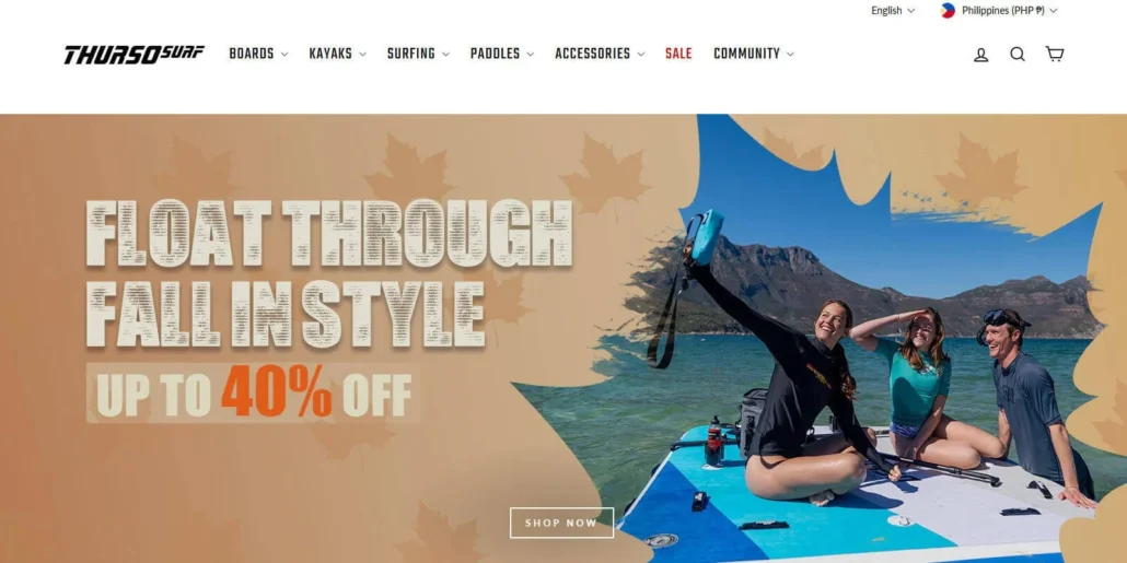 Three people sitting on a paddleboard on a lake surrounded by mountains, advertising a fall sale with up to 40% off by Thurso Surf.