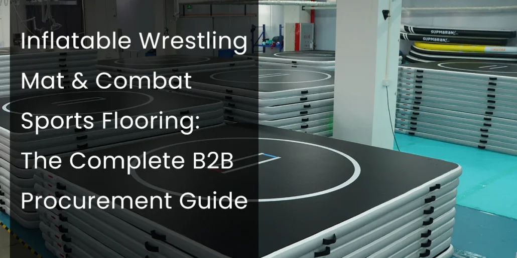 Stacks of black inflatable wrestling mats with white markings in a sports warehouse alongside text about B2B procurement for combat sports flooring.