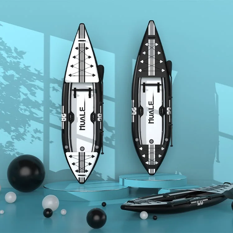 Two inflatable kayaks, one black and one white, set upright on modern blue display platforms with abstract background accents.