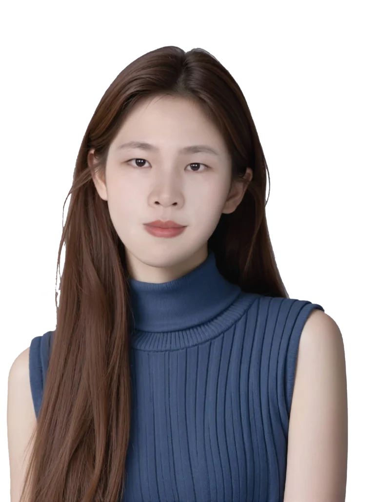 Woman with long brown hair wearing a ribbed blue turtleneck sweater, posing for a portrait.