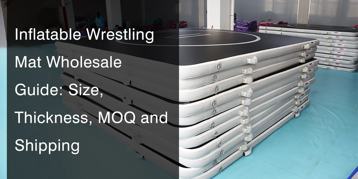 Stacked inflatable wrestling mats in a warehouse, showing durable construction and rounded edges, with wholesale details provided.